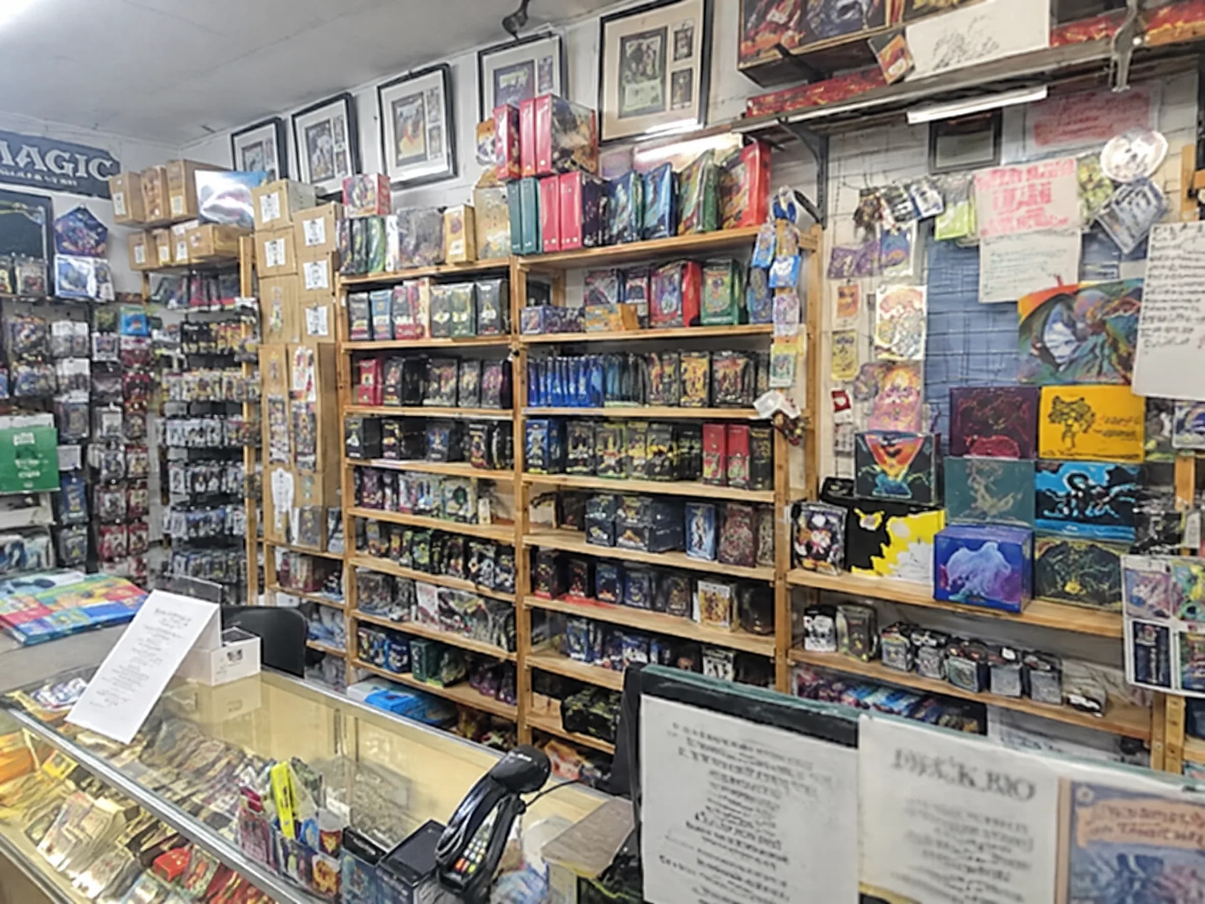 Staff behind the counter helping a young customer.