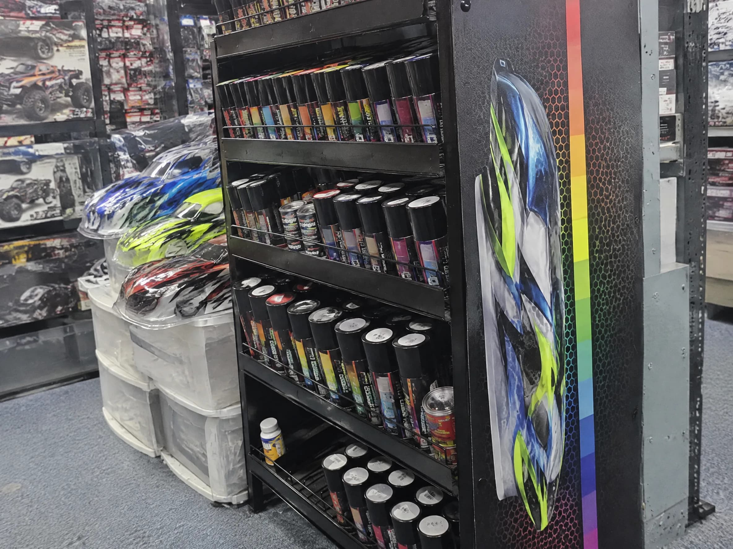 Custom-painted RC body shells at the paint station.